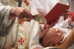 (Pope Benedict Baptizing a baby) 'Be who you are' is the basic educational principle of the human person redeemed by grace. Image of (Pope Benedict Baptizing a baby) 'Be who you are' is the basic educational principle of the human person redeemed by grace.