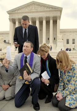 Rev. Rob Schenck (kneeling) maintains a ministry office across the street from the US Supreme Court, one block from the U.S. Capitol and ten minutes from the White House. He is known on Capitol Hill where he ministers to those who serve in Government. He is a stalwart defender of children in the womb and a prophetic voice. Image of Rev. Rob Schenck (kneeling) maintains a ministry office across the street from the US Supreme Court, one block from the U.S. Capitol and ten minutes from the White House. He is known on Capitol Hill where he ministers to those who serve in Government. He is a stalwart defender of children in the womb and a prophetic voice.