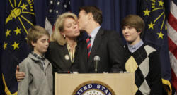 Senator Evan Bayh of Indiana surrounded by his family as he announces he will retire from the Senate. Image of Senator Evan Bayh of Indiana surrounded by his family as he announces he will retire from the Senate.