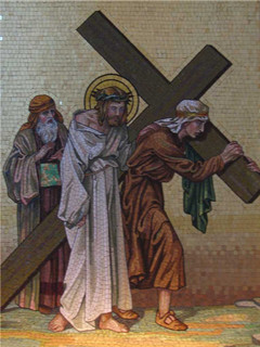 Fifth Station: Simon of Cyrene helps Jesus to carry his cross. Image of Fifth Station: Simon of Cyrene helps Jesus to carry his cross.
