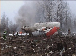 This image from Polish Television's TVP via APTN shows a firefighter walking near some of the wreckage at the crash site where Polish President Lech Kaczynski, his wife and some of the country's most prominent military and civilian leaders died Saturday April 10, 2010 along with dozens of others when the presidential plane crashed as it came in for a landing in thick fog in near Smolensk in western Russia. Image of This image from Polish Television's TVP via APTN shows a firefighter walking near some of the wreckage at the crash site where Polish President Lech Kaczynski, his wife and some of the country's most prominent military and civilian leaders died Saturday April 10, 2010 along with dozens of others when the presidential plane crashed as it came in for a landing in thick fog in near Smolensk in western Russia.