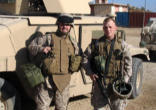 (Photo furnished by the Department of Defense) Fr. Duesterhaus with RP and Tank in Iraq. Image of (Photo furnished by the Department of Defense) Fr. Duesterhaus with RP and Tank in Iraq.