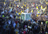 Pope Benedict traveling through the enthusiastic crowd on the way to the altar for the first Mass in Scotland at the beginning of his visit to the UK. Image of Pope Benedict traveling through the enthusiastic crowd on the way to the altar for the first Mass in Scotland at the beginning of his visit to the UK.