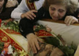 Iraqi Christians mourning the loss of one of their beloved priests killed by Muslim extremists Image of Iraqi Christians mourning the loss of one of their beloved priests killed by Muslim extremists