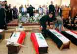 Several of the coffins holding the bodies of Catholics killed, while attending Holy Mas, by Muslim extremists in Iraq Image of Several of the coffins holding the bodies of Catholics killed, while attending Holy Mas, by Muslim extremists in Iraq