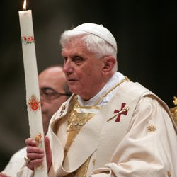 Benedict began the service by lighting a candle and walking down a darkened central aisle of St. Peter's Basilica in silence, while hundreds of faithful in the pews shared the flame from candle to candle until the entire basilica twinkled. Benedict began the service by lighting a candle and walking down a darkened central aisle of St. Peter's Basilica in silence, while hundreds of faithful in the pews shared the flame from candle to candle until the entire basilica twinkled.