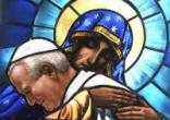 Blessed Pope John Paul entrusted himself to the arms of the Blessed Virgin Mary with the words of his motto Image of Blessed Pope John Paul entrusted himself to the arms of the Blessed Virgin Mary with the words of his motto