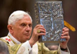 Pope Benedict XVI carrying the Book of the Gospels Image of Pope Benedict XVI carrying the Book of the Gospels