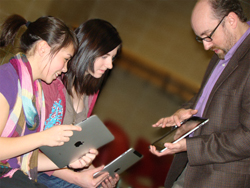 Briar Cliff will provide Apple iPads to all first-year, full-time students, beginning with the fall 2011 semester. Test driving the iPads are Sam Shanks, BCU's division chairperson of general education and assistant professor of theatre, and incoming freshmen Erica LoVan, North High School, left, and Brittany Copple, Peacemakers Academy, right. Image of Briar Cliff will provide Apple iPads to all first-year, full-time students, beginning with the fall 2011 semester. Test driving the iPads are Sam Shanks, BCU's division chairperson of general education and assistant professor of theatre, and incoming freshmen Erica LoVan, North High School, left, and Brittany Copple, Peacemakers Academy, right.