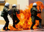Police under assault from protesters opposed to the latest round of austerity measures imposed by Parliament. Image of Police under assault from protesters opposed to the latest round of austerity measures imposed by Parliament.