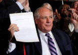 Illinois Governor Pat Quinn holds up the signed civil unions bill Image of Illinois Governor Pat Quinn holds up the signed civil unions bill