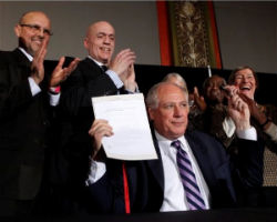 Illinois Governor Pat Quinn holds up the signed civil unions bill Illinois Governor Pat Quinn holds up the signed civil unions bill