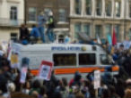 Overwhelmed London police are being reinforced tonight by up to 16,000 officers to quell the riots. Image of Overwhelmed London police are being reinforced tonight by up to 16,000 officers to quell the riots.