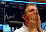 Investors watch as the markets tumble on a series of bad economic reports and forecasts. Image of Investors watch as the markets tumble on a series of bad economic reports and forecasts.
