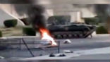 A Syrian armored personnel carrier rolls into the site of civilian anti-government protests. Image of A Syrian armored personnel carrier rolls into the site of civilian anti-government protests.