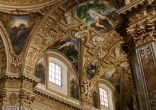 The basilica, richly decorated in stucco and mosaics, enshrines the relics of St. Benedict and his sister, St. Scholastica, which survived the bombings in World War II.
Image of The basilica, richly decorated in stucco and mosaics, enshrines the relics of St. Benedict and his sister, St. Scholastica, which survived the bombings in World War II.
