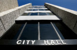 City hall is making more cuts as the recession grinds on. Image of City hall is making more cuts as the recession grinds on.