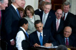 President Obama signs the Affordable Care Act into law in this file photo. Image of President Obama signs the Affordable Care Act into law in this file photo.