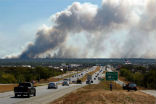 Thousands of people have been displaced by the fires which have burned near the edge of several cities and towns in Texas. Image of Thousands of people have been displaced by the fires which have burned near the edge of several cities and towns in Texas.