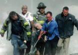 Fr. Mychal Judge's body being carried out of the rubble of the Towers on 9/11/01 Image of Fr. Mychal Judge's body being carried out of the rubble of the Towers on 9/11/01