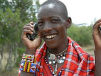 This Masai man has plenty of reason to smile. Cell phones are making his world a better place. Image of This Masai man has plenty of reason to smile. Cell phones are making his world a better place.