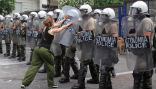 A lone protester challenges the police during protests in June in this file photo. Image of A lone protester challenges the police during protests in June in this file photo.