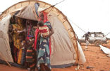 Refugees must pack themselves into makeshift homes like this tent. Image of Refugees must pack themselves into makeshift homes like this tent.