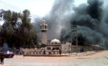 Buildings burn as a result of Friday's violence. Image of Buildings burn as a result of Friday's violence.