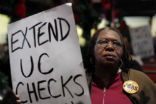 An unemployed woman protests for the extension of unemployment benefits. The future remains bleak for the long-term unemployed as their skills become outdated. Image of An unemployed woman protests for the extension of unemployment benefits. The future remains bleak for the long-term unemployed as their skills become outdated.
