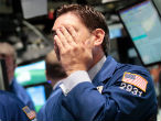 A trader doesn't like what he sees during Friday's session. Image of A trader doesn't like what he sees during Friday's session.