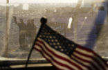 Iraqis wave goodbye as the American armored vehicle departs. Image of Iraqis wave goodbye as the American armored vehicle departs.