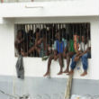 Haitian jails are so overcrowded, that many cannot lie down at night. Image of Haitian jails are so overcrowded, that many cannot lie down at night.