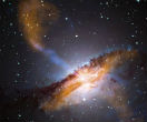 Galaxy Centaurus A in this composite image. Note the blue jet of material being shot out of the galaxy's core. The jet is being caused by a supermassive black hole. The jet is longer than the galaxy itself; it is one way scientists can observe black holes without seeing them directly. Image of Galaxy Centaurus A in this composite image. Note the blue jet of material being shot out of the galaxy's core. The jet is being caused by a supermassive black hole. The jet is longer than the galaxy itself; it is one way scientists can observe black holes without seeing them directly.