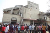 Nigerian catholics outside of St Theresa's catholic Church after the bombing Image of Nigerian catholics outside of St Theresa's catholic Church after the bombing
