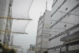 Suicide nets at the Foxconn factory in China where Apple products are assembled. Image of Suicide nets at the Foxconn factory in China where Apple products are assembled.