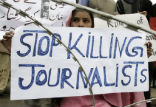 A Pakistani woman protests the killings of journalists. The country cannot be truly free while its people are afraid to report the truth. Image of A Pakistani woman protests the killings of journalists. The country cannot be truly free while its people are afraid to report the truth.