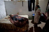 The deceased body of Jesus Flores, 51, lies in bed before his mother. Flores died of CKD on January 19th and is one of thousands across the region who will meet the same fate this year alone. Image of The deceased body of Jesus Flores, 51, lies in bed before his mother. Flores died of CKD on January 19th and is one of thousands across the region who will meet the same fate this year alone.