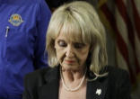 Governor Jan Brewer signing legislation Image of Governor Jan Brewer signing legislation