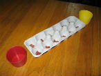 Games such as mancala can be improvised using household items and can make for hours of summertime fun. Image of Games such as mancala can be improvised using household items and can make for hours of summertime fun.