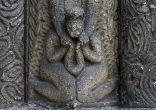 In a hallucinatory touch worthy of M.C. Escher, the figure on the inner bottom right jamb grasps the two solid grooves and pulls them around his neck like a scarf. Image of In a hallucinatory touch worthy of M.C. Escher, the figure on the inner bottom right jamb grasps the two solid grooves and pulls them around his neck like a scarf.