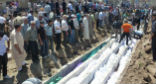 Civilians buried in a mass grave following the Houla massacre. Almost half were children. Image of Civilians buried in a mass grave following the Houla massacre. Almost half were children.