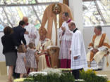 Pope greets a family in Milan Image of Pope greets a family in Milan