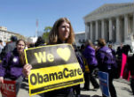 An Obama supporter holds a sign at a pro-Obamacare rally earlier in the year. Image of An Obama supporter holds a sign at a pro-Obamacare rally earlier in the year.