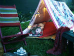 A backyard tent can be improvised and setting it up is part of the fun! Image of A backyard tent can be improvised and setting it up is part of the fun!