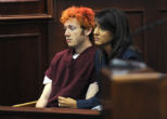 Holmes did not speak during the proceedings. Image of Holmes did not speak during the proceedings.