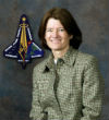 Sally Ride in front of the mission patch for STS-107 (Columbia). Ride served on the boards that investigated both the Challenger and Columbia accidents. Image of Sally Ride in front of the mission patch for STS-107 (Columbia). Ride served on the boards that investigated both the Challenger and Columbia accidents.