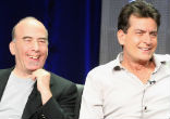 Actor Charlie Sheen as seen with executive producer Bruce Helford, Sheen made a series of bizarre appearances following his departure from the TV show Image of Actor Charlie Sheen as seen with executive producer Bruce Helford, Sheen made a series of bizarre appearances following his departure from the TV show