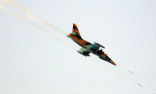 A Syrian warplane fires its rockets. Image of A Syrian warplane fires its rockets.