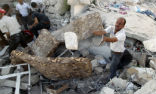 Civilians must clear rubble and search for survivors without the aid of heavy equipment. Image of Civilians must clear rubble and search for survivors without the aid of heavy equipment.