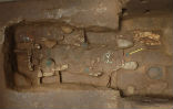 The grave has yielded many artifacts, but no body. Image of The grave has yielded many artifacts, but no body.